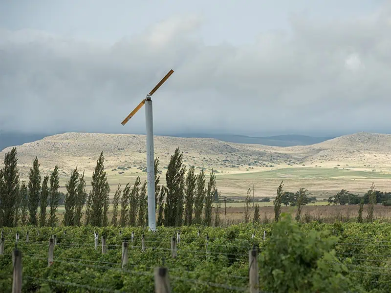 wind machine in a hillside orchard