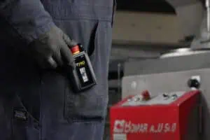 factory worker with tyro emergency stop hooked on pocket
